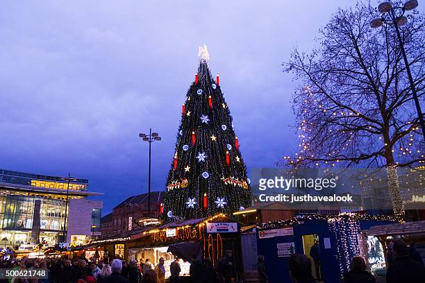 evening scene on christmas market dortmund - dortmund stad stock pictures, royalty-free photos & images