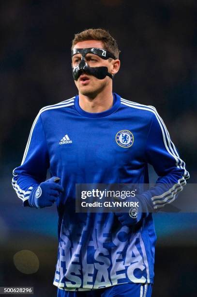 Chelsea's Serbian midfielder Nemanja Matic warms up wearing a face mask to protect a fractured nose and cheekbone before kick off of the UEFA...