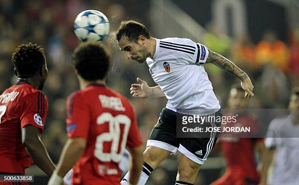 Valencia's forward Paco Alcacer heads a ball during the UEFA Champions League football match Valencia CF vs Olympique Lyonnais at the Mestalla...