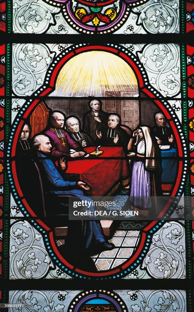 Stained glass depicting Bernadette Soubirous...