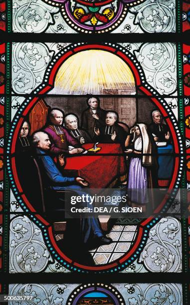 Stained glass depicting Bernadette Soubirous in front of the commission of enquiry, Basilica of Our Lady of the Rosary, Lourdes, Midi-Pyrenees,...