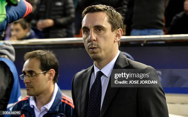 Valencia's Britihs coach Gary Neville gestures from the sideline during the UEFA Champions League football match Valencia CF vs Olympique Lyonnais at...