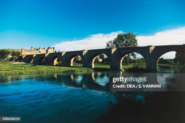 Bridge on the Aude river and the city of Carcassonne , Languedoc-Roussillon, France.