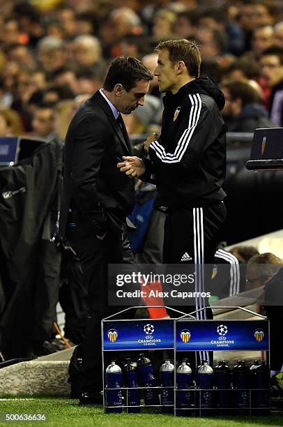 Gary Neville manager of Valencia and Assistant, Phil Neville react during the UEFA Champions League Group H match between Valencia CF and Olympique...