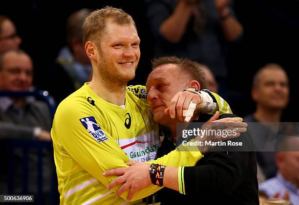 Johannes Bitter, goaltender of Hamburg celebrate with head coach Michael Biegler during the DKB Bundesliga handball match between HSV Handball and...