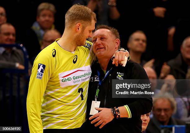 Johannes Bitter, goaltender of Hamburg celebrate with head coach Michael Biegler during the DKB Bundesliga handball match between HSV Handball and...