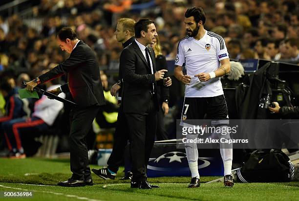 Gary Neville manager of Valencia speaks with Alvaro Negredo of Valencia during the UEFA Champions League Group H match between Valencia CF and...