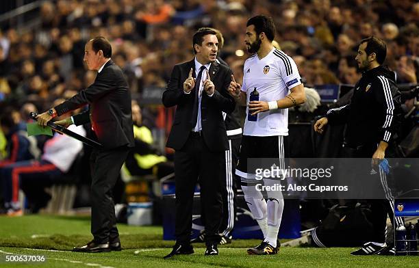 Gary Neville manager of Valencia speaks with Alvaro Negredo of Valencia during the UEFA Champions League Group H match between Valencia CF and...