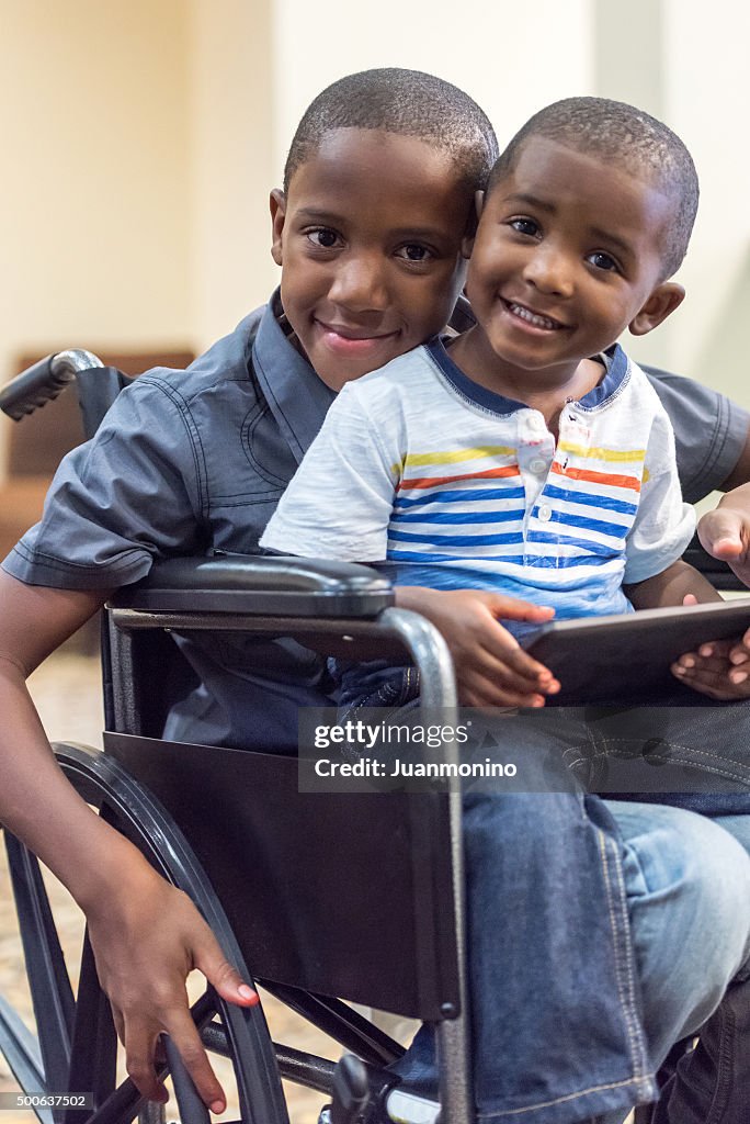 Handicap child playing with his little brother