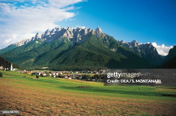 View of Dobbiaco, with Cima Nove and Sella di Dobbiaco in the background, Dolomites, Trentino-Alto Adige, Italy.