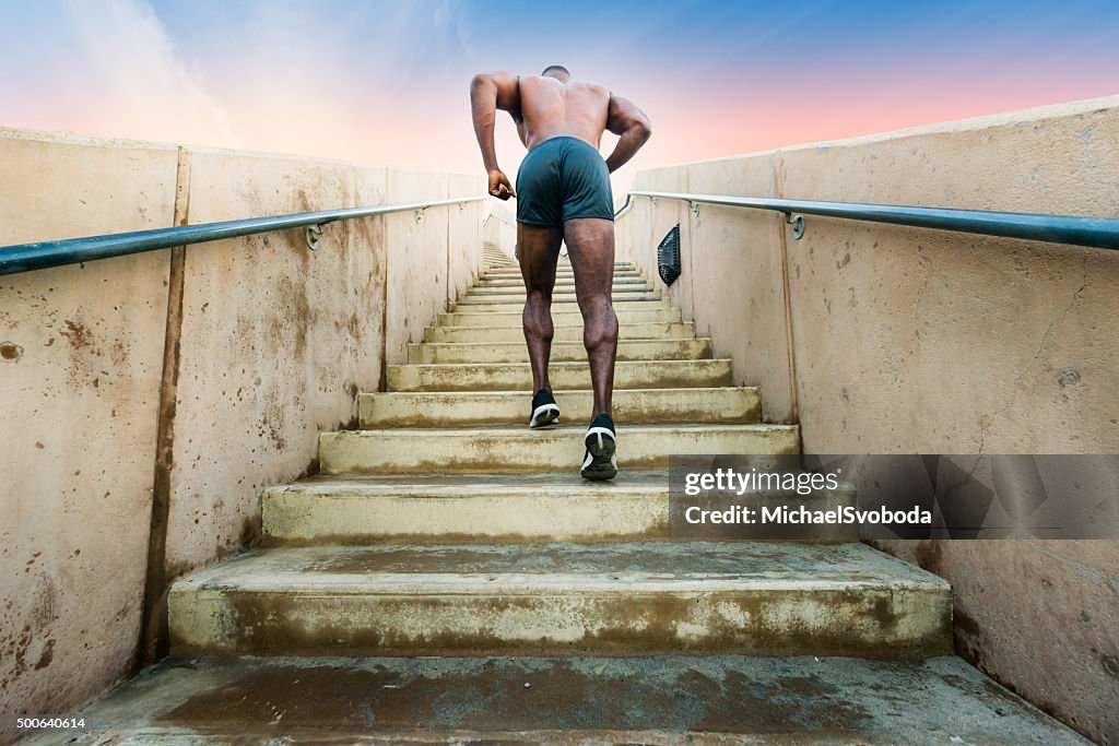 Muscular Man Running Up And Down The Stairs
