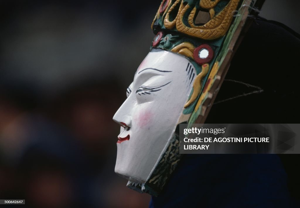 Female mask worn during the Dixi performance...