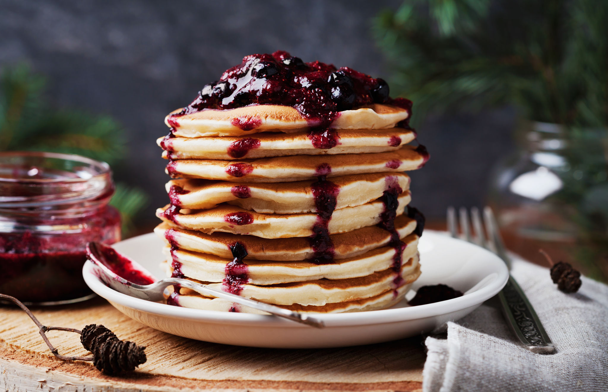 Stack of pancakes or fritters with strawberry and blueberry jam Stack of pancakes or fritters with strawberry and blueberry jam