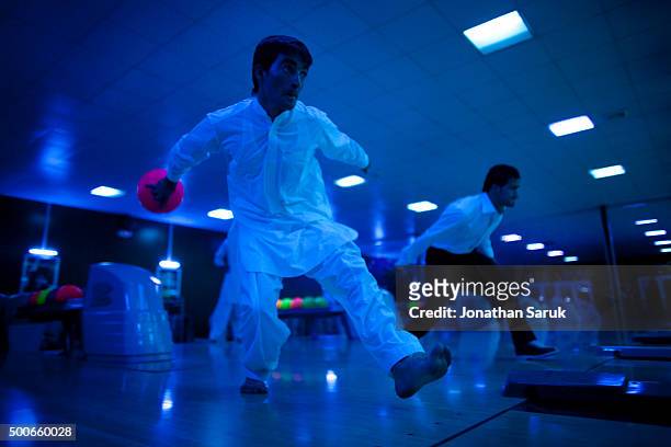 Young afghans bowling at The Strikers, Afghanistan's first bowling alley September 29, 2011 in Kabul, Afghanistan. The Afghan owned bowling alley...