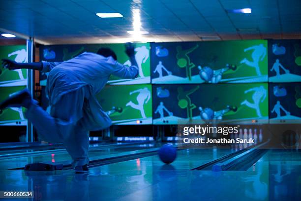 Young afghans bowling at The Strikers, Afghanistan's first bowling alley September 30, 2011 in Kabul, Afghanistan. The Afghan owned bowling alley...