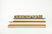 Esperanto language word on wood stamps and books