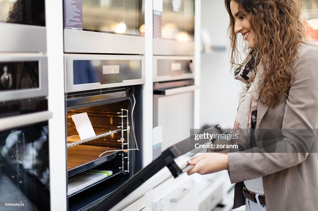 Woman buying stove