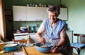 Senior woman baking