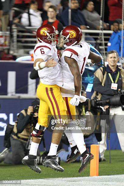 Cody Kessler and Darreus Rogers of the USC Trojans celebrate after a touch down during a 41-22 Stanford win at the PAC-12 Championship game at Levi's...
