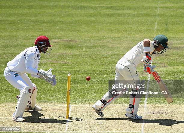 David Warner of Australia is caught behind by Denesh Ramdin of the West Indies during day one of the First Test match between Australia and the West...