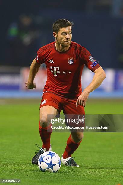 Xabi Alonso of Muenchen runs with the ball during the UEFA Champions League Group F match between GNK Dinamo Zagreb and FC Bayern Muenchen at...