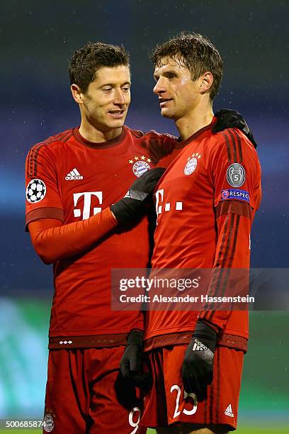 Robert Lewandowski of Muenchen talks to his team mate Thomas Mueller during the UEFA Champions League Group F match between GNK Dinamo Zagreb and FC...