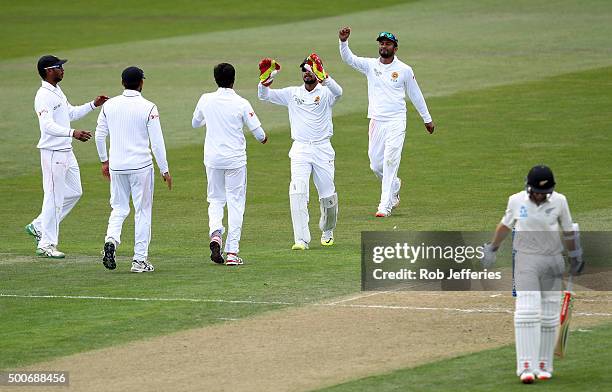 Kane Williamson of New Zealand departs after being dismissed caught behind by Dimuth Karunaratne of Sri Lanka off the bowling of Nuwan Pradeep during...