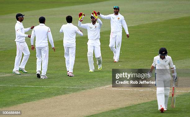 Kane Williamson of New Zealand departs after being dismissed caught behind by Dimuth Karunaratne of Sri Lanka off the bowling of Nuwan Pradeep during...