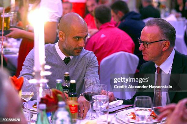 Karl-Heinz Rummenigge , CEO of FC Bayern Muenchen talks to Josep Guardiola, head coach of Bayern Muenchen during the Champions Banquet after the UEFA...