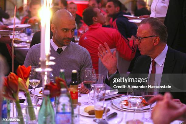 Karl-Heinz Rummenigge , CEO of FC Bayern Muenchen talks to Josep Guardiola, head coach of Bayern Muenchen during the Champions Banquet after the UEFA...