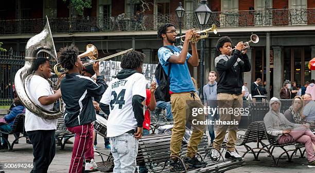 jazz musicians busk in jackson square, new orleans - street artist stock pictures, royalty-free photos & images