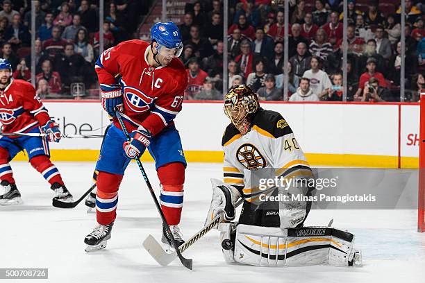 Tuukka Rask of the Boston Bruins makes a save with Max Pacioretty of the Montreal Canadiens standing in front during the NHL game at the Bell Centre...