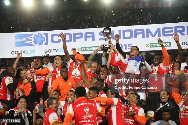 Players of Independiente Santa Fe lift the trophy to celebrate after winning the Copa Sudamericana final match between Independiente Santa Fe and...