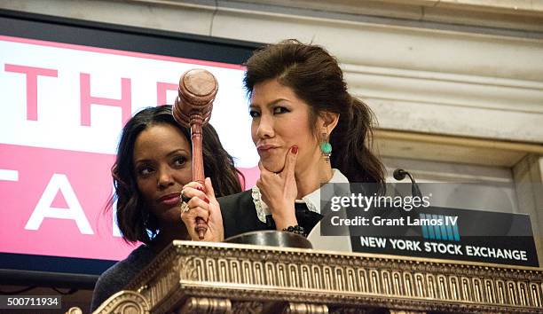 Aisha Tyler and Julie Chen of CBS' 'The Talk' ring the closing bell at the New York Stock Exchange on December 9, 2015 in New York City.