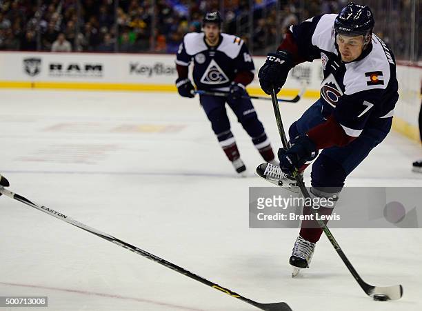 John Mitchell of the Colorado Avalanche takes a shot on goal during the first period at the Pepsi Center on December 9, 2015 in Denver, Colorado.