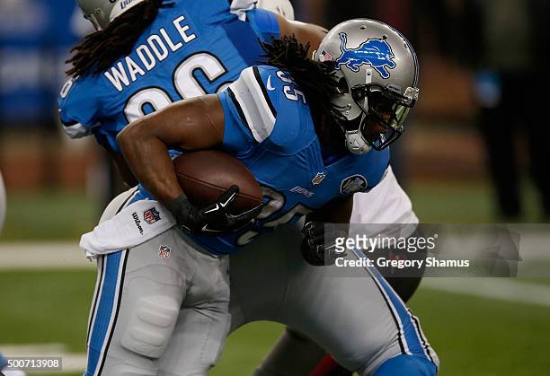 Joique Bell of the Detroit Lions looks to gain yards while playing the Tampa Bay Buccaneers at Ford Field on December 07, 2014 in Detroit, Michigan....