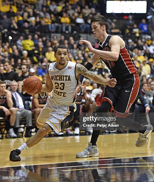 Guard Fred VanVleet of the Wichita State Shockers drives around forward Stephen Zimmerman Jr. #33 of the UNLV Rebels during the first half on...