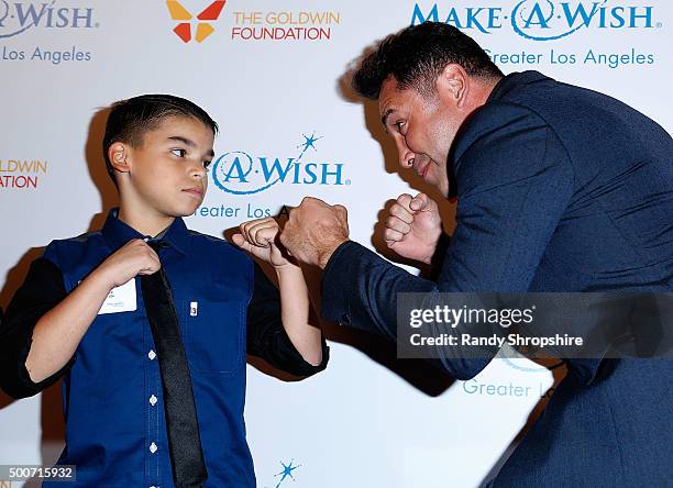 Oscar De La Hoya and "wish kid" arrive at Make-A-Wish Greater Los Angeles honors Oscar De La Hoya, Michael Rosenfeld and Tom Mone at its annual...