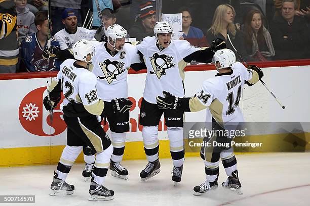 Beau Bennett of the Pittsburgh Penguins celebrates his goal against the Colorado Avalanche with teammates Ben Lovejoy, Sidney Crosby and Chris Kunitz...