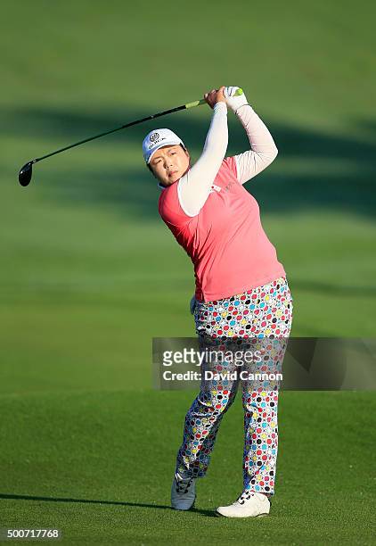 Shanshan Feng of China plays her third shot on the par 5, 10th hole during the second round of the 2015 Omega Dubai Ladies Masters on the Majlis...