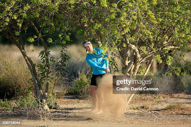 Caroline Masson of Germany plays her fourth shot from some desert scrub on the par 5, 10th hole after she had only moved her ball a matter of inches...