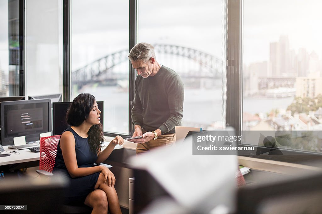 Business people in the office working with a digital tablet