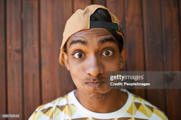 never be too serious - teenage boy in cap posing stock pictures, royalty-free photos & images