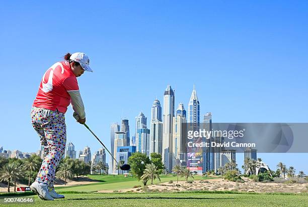 Shanshan Feng of China plays her tee shot on the par 4, eighth hole during the second round of the 2015 Omega Dubai Ladies Masters on the Majlis...