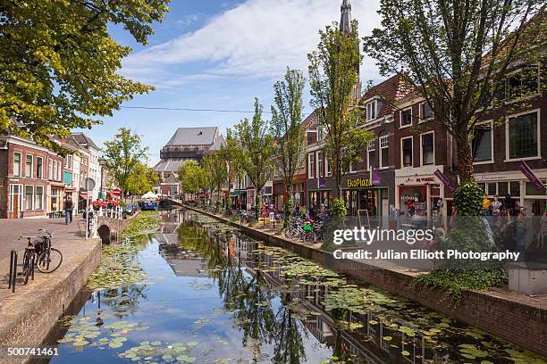 a canal in the historic centre of delft - delft stock pictures, royalty-free photos & images