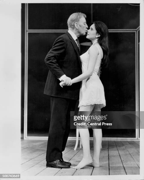 Actors Sir Alec Guinness and Madeline Smith, on stage in the play 'Habeas Corpus', at the Lyric Theatre, London, May 9th 1973.