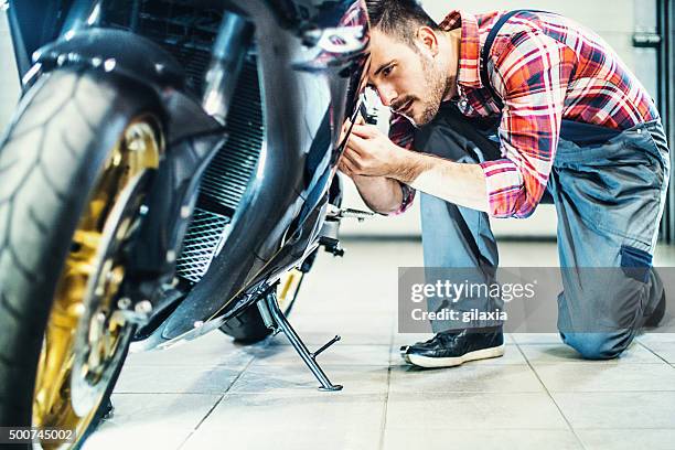 bike repair. - motorcycle mechanic stock pictures, royalty-free photos & images