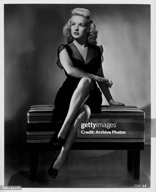 Portrait of actress Betty Grable wearing a black dress, as she appears in the movie 'I Wake Up Screaming', 1941.