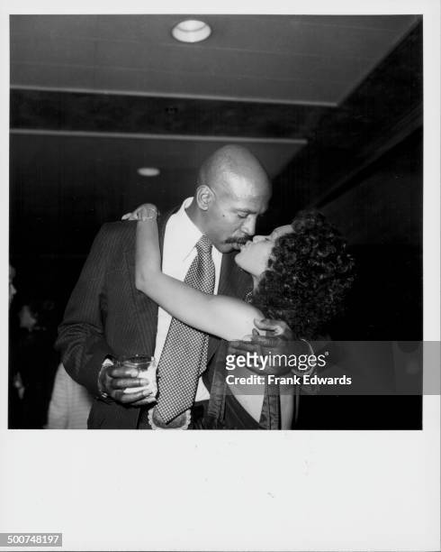 Actor Lou Gossett Jr and actress Tina Andrews, kissing at the NBC Television party at the Century Plaza Hotel, Los Angleles, May 1977.