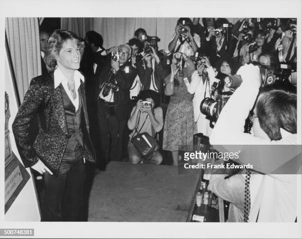 Singer Andy Gibb, being photographed by the press, as he attends the 21st Grammy Awards, Shrine Auditorium, California, February 15th 1979.